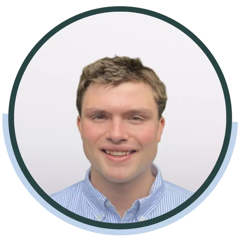 Daniel Vardon, ideea group team member, smiling in a blue striped shirt