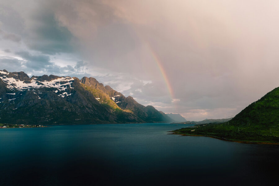 A rainbow in a rainy sky over mountains and a lake in Germany for accelerating action on nature with A-Track