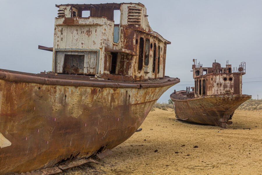 Two rusted, abandoned ships on what was the Aral Sea