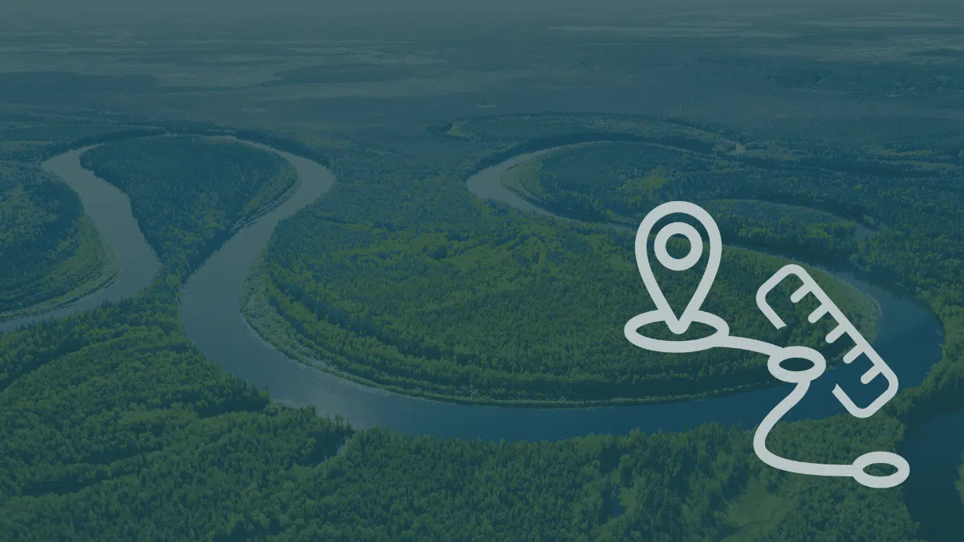 Aerial view of a winding river through green wetland with a location pin and measuring ruler icon