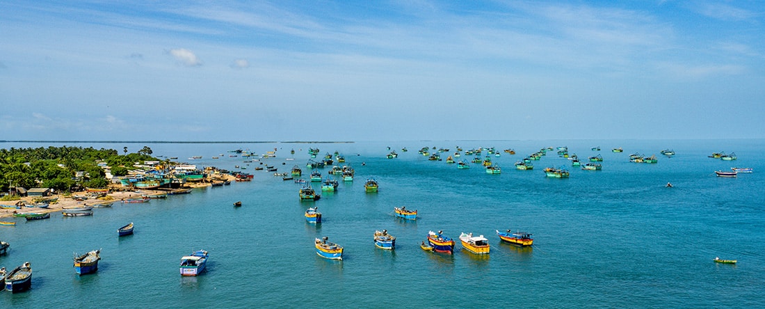 Fishing boats on the ocean in India for India is on the path toward a sustainable, blue economy