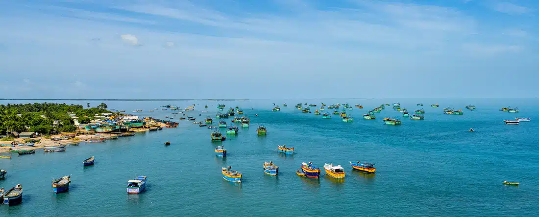 Fishing boats on the ocean in India for India is on the path toward a sustainable, blue economy