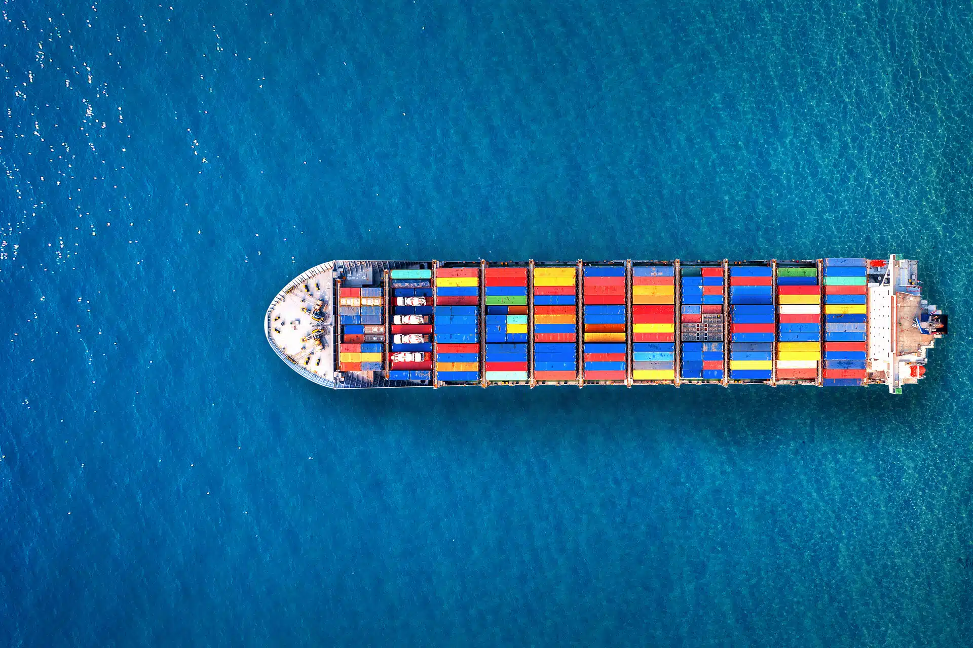 A cargo ship at sea. Climate change tracking with OECD statistics